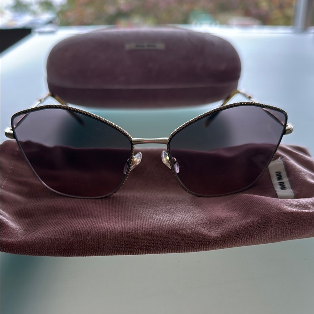 Miu Miu Elegant Gold Frame Sunglasses with Dark Lenses